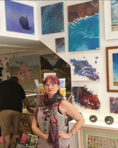 Karen stood by artworks in the Talent Gallery